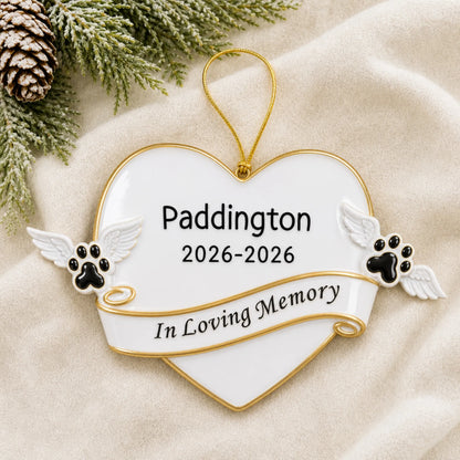 Personalized Pet Memorial christmas ornament laid on a soft white knit blanket