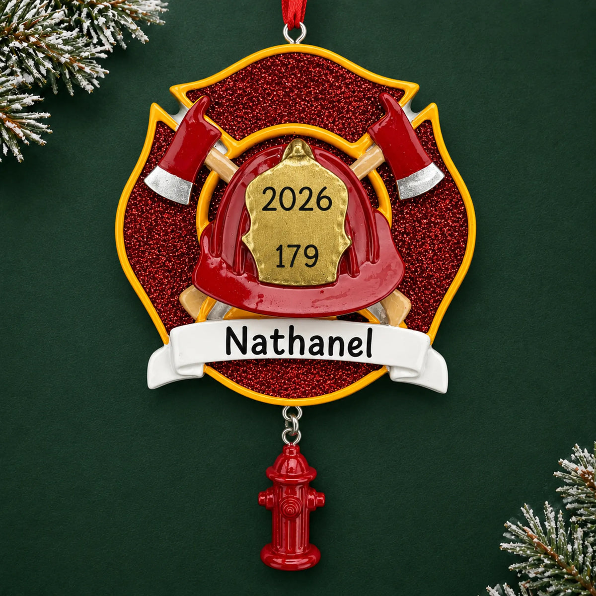 Personalized firefighter emblem christmas ornament on a dark green pine background