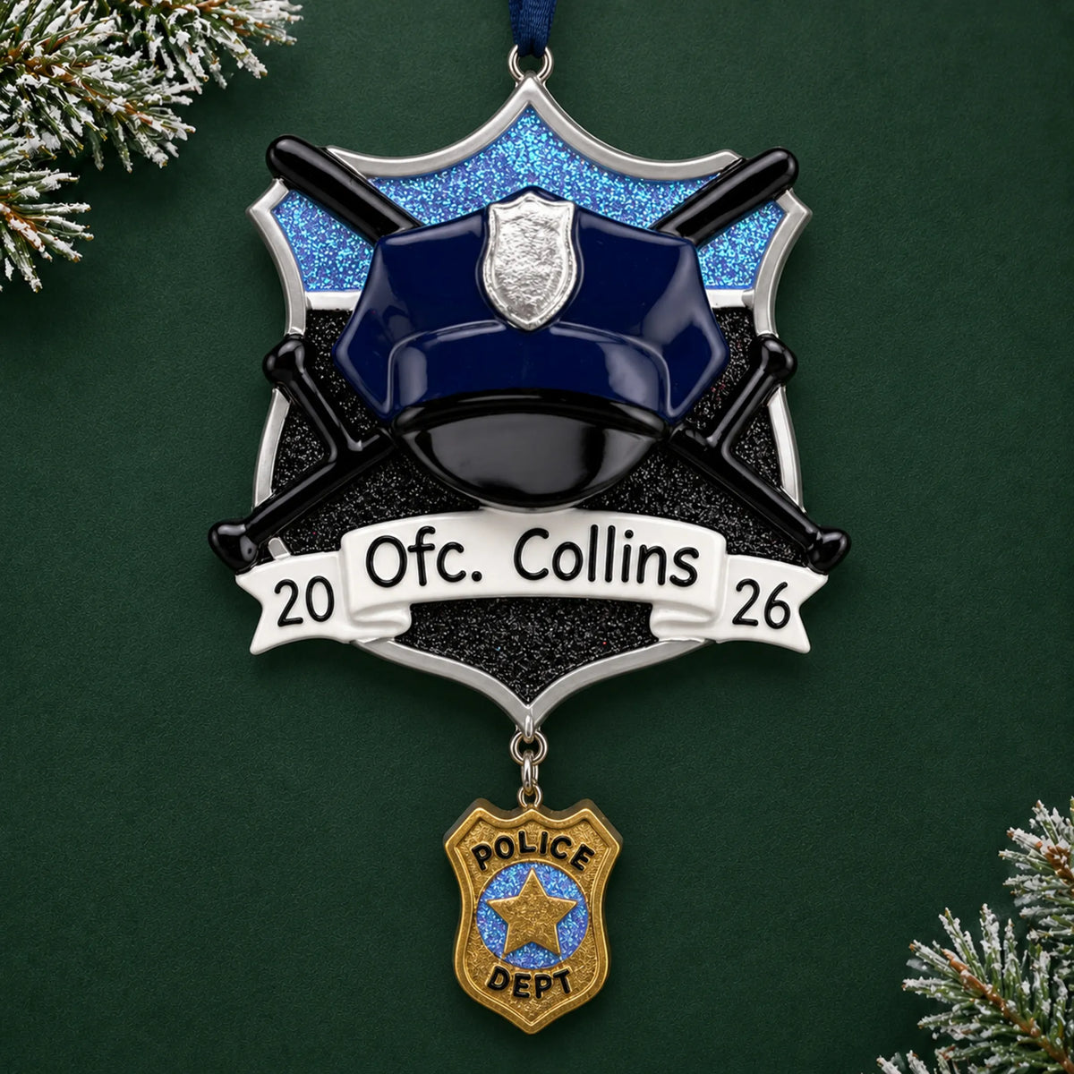 Personalized police officer christmas ornament on a dark green pine background