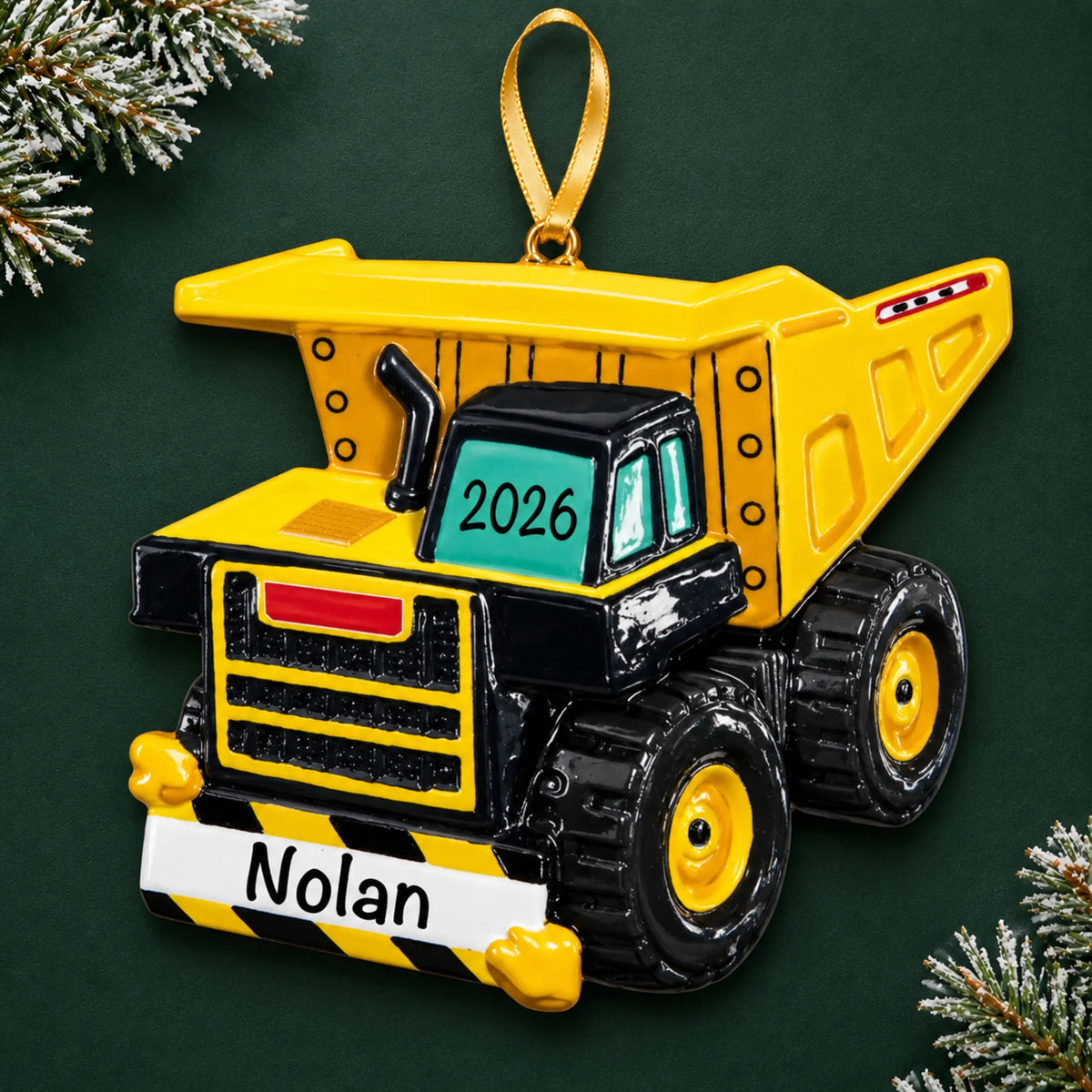 Personalized dump truck xl christmas ornament on a dark green pine background