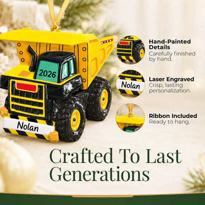 Hand-painted details and laser engraved personalization on the dump truck xl christmas ornament, ribbon included
