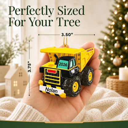 Size guide: the personalized dump truck xl christmas ornament is 3.50 in wide by 3.75 in tall, shown in hand