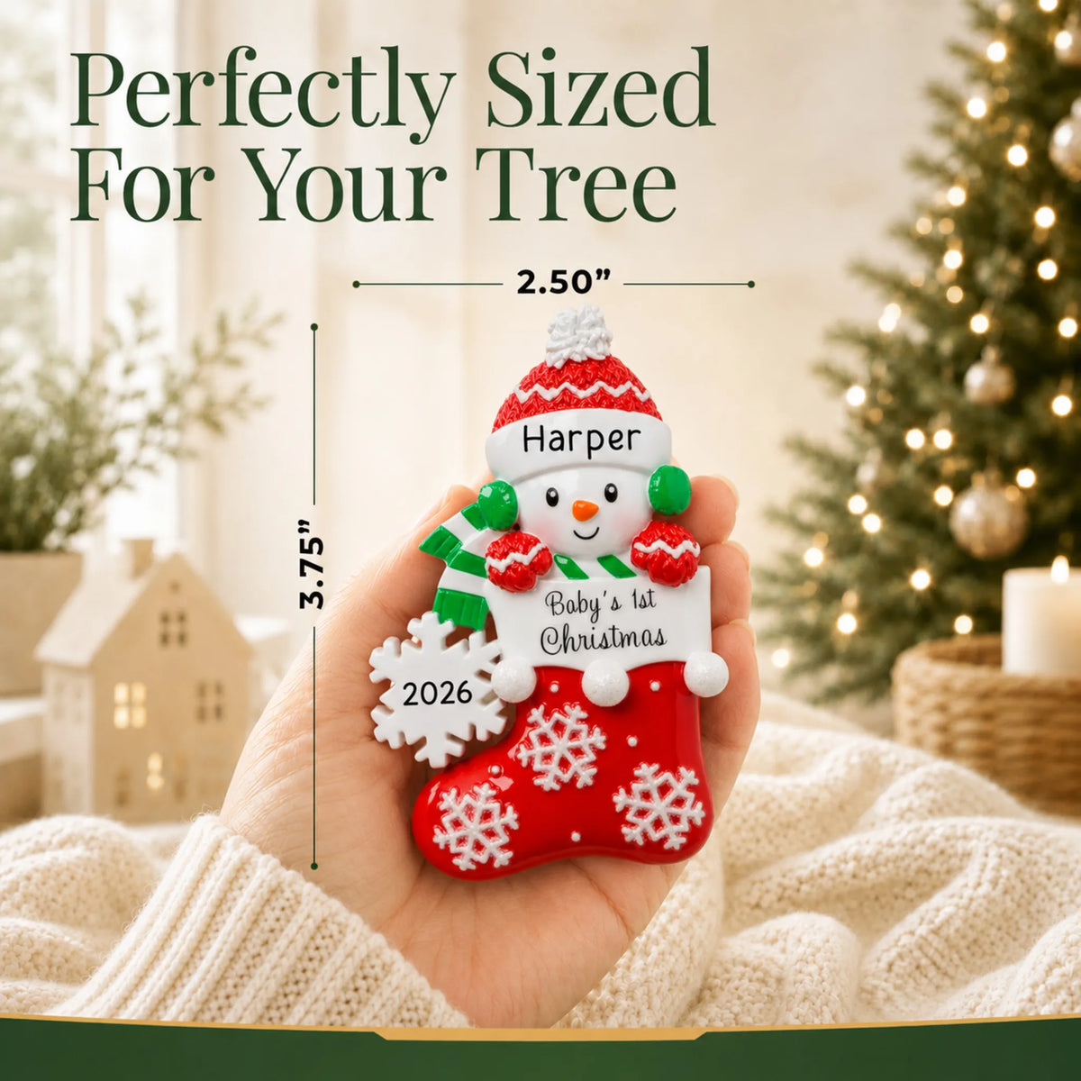 Size guide: the personalized red snowman baby's 1st christmas ornament is 2.50 in wide by 3.75 in tall, shown in hand