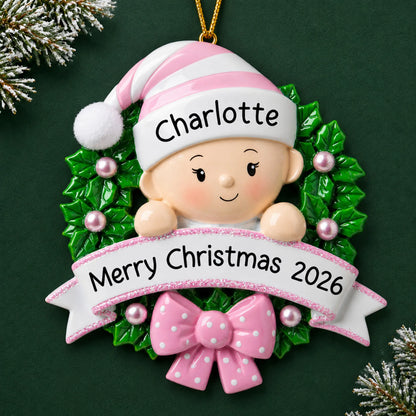 Personalized pink baby girl wreath christmas ornament on a dark green pine background