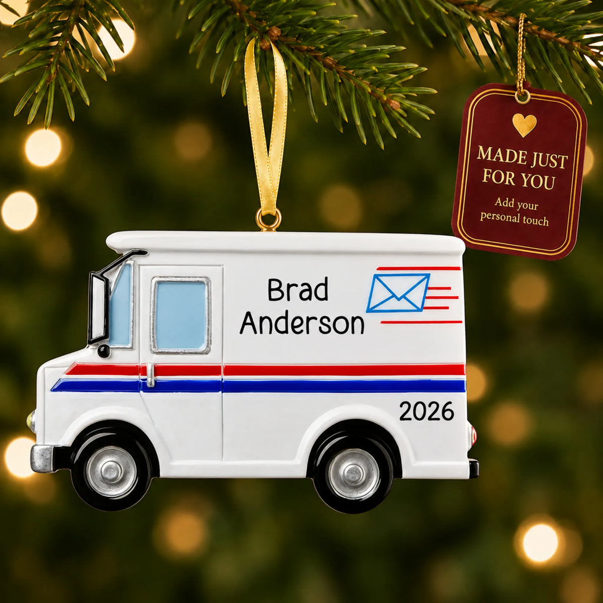 Postal worker mail truck christmas ornament hanging on a lit Christmas tree with a Made Just For You gift tag