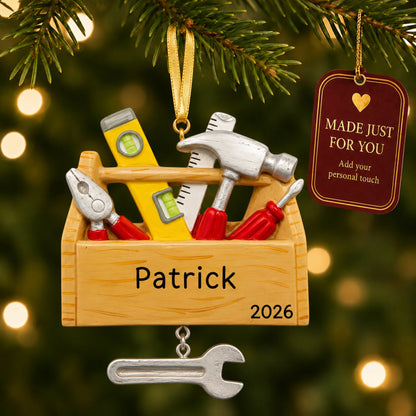 Handyman tool box christmas ornament hanging on a lit Christmas tree with a Made Just For You gift tag