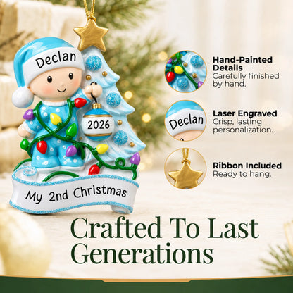 Hand-painted details and laser engraved personalization on the blue baby's 2nd christmas ornament, ribbon included