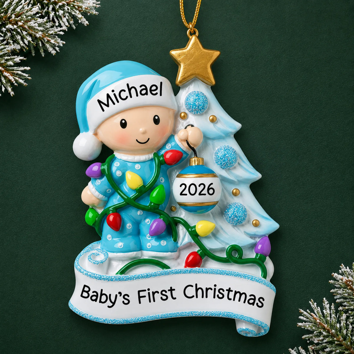 Personalized blue baby's 1st christmas tree ornament on a dark green pine background