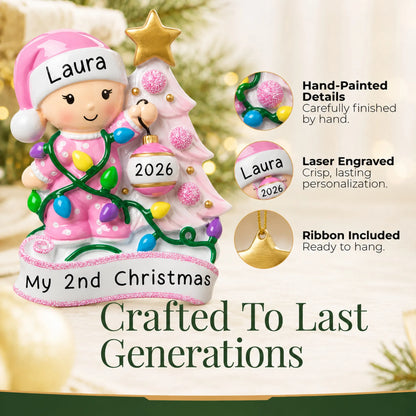 Hand-painted details and laser engraved personalization on the pink baby's 2nd christmas ornament, ribbon included