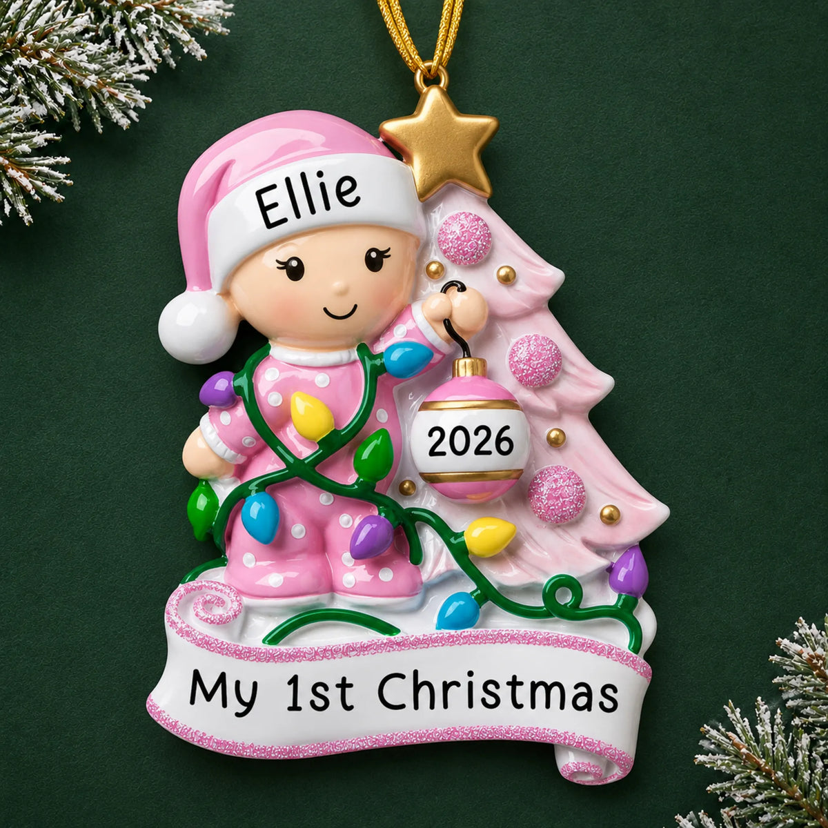 Personalized pink baby's 1st christmas tree ornament on a dark green pine background