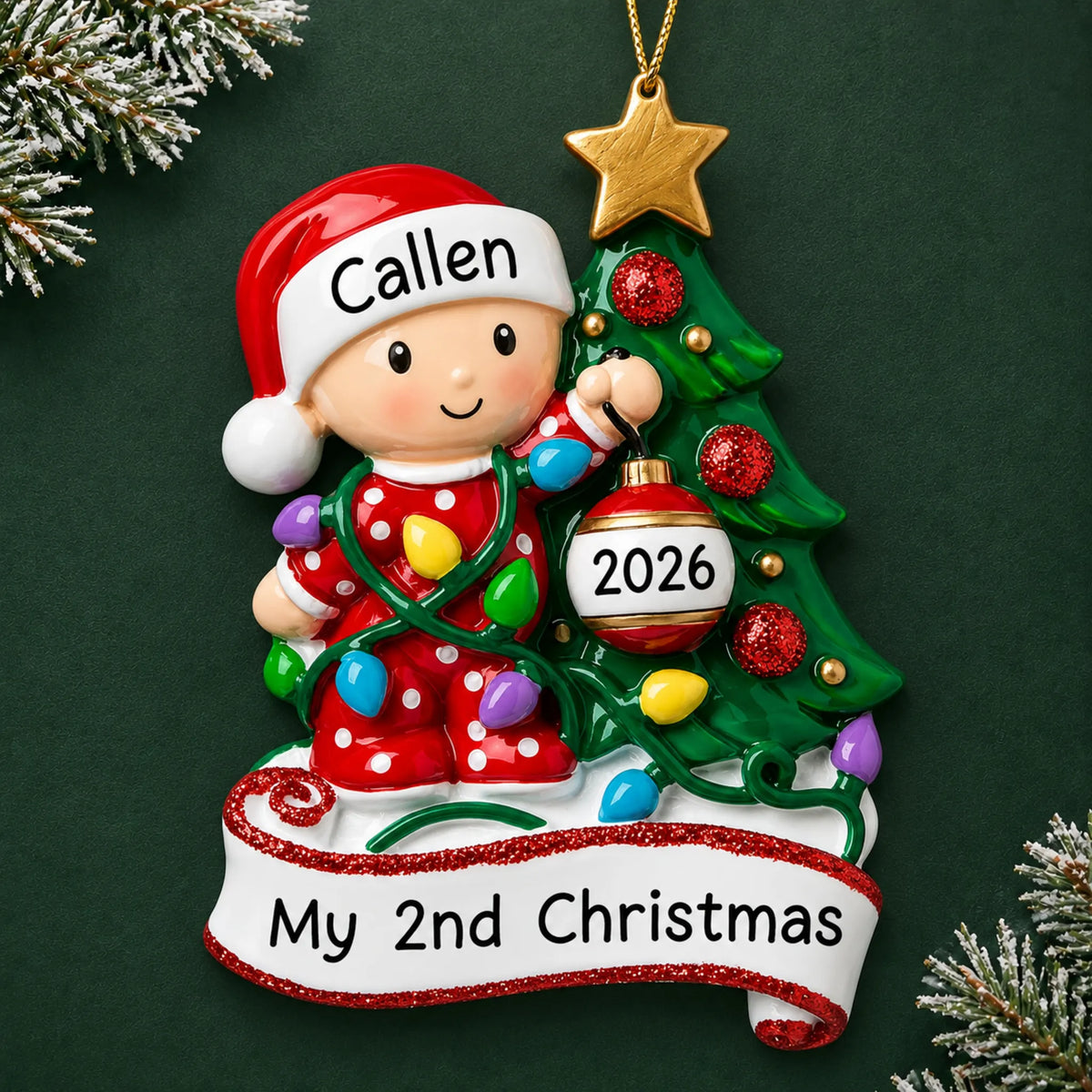 Personalized red baby's 2nd christmas ornament on a dark green pine background