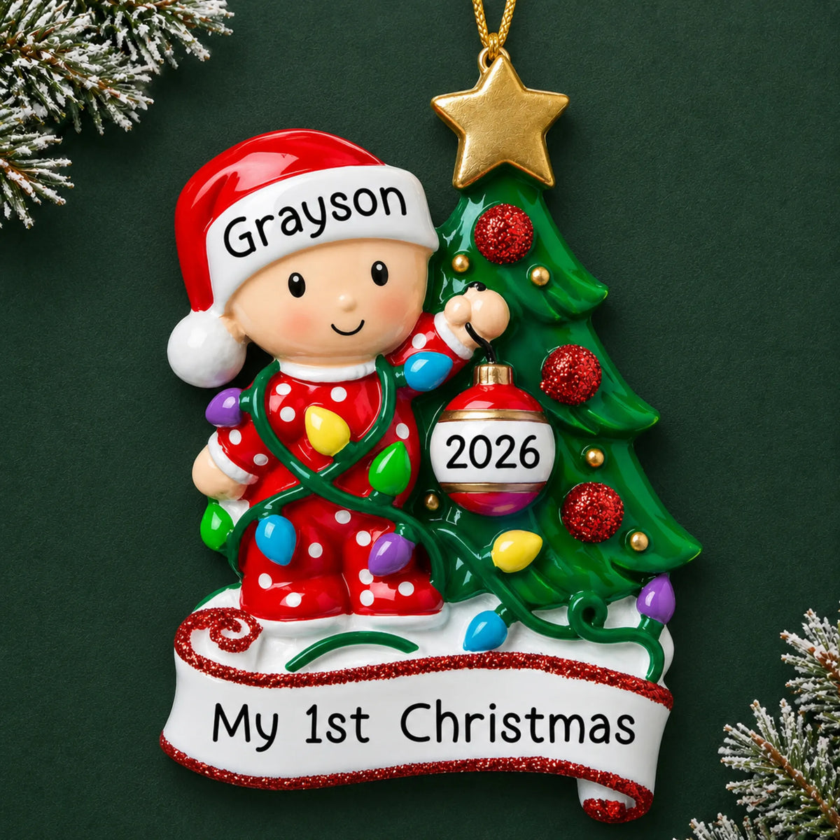 Personalized red baby's 1st christmas tree ornament on a dark green pine background
