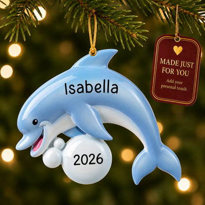 Dolphin fun christmas ornament hanging on a lit Christmas tree with a Made Just For You gift tag