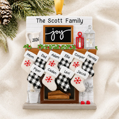 Personalized fireplace stockings family of 10 christmas ornament laid on a soft white knit blanket