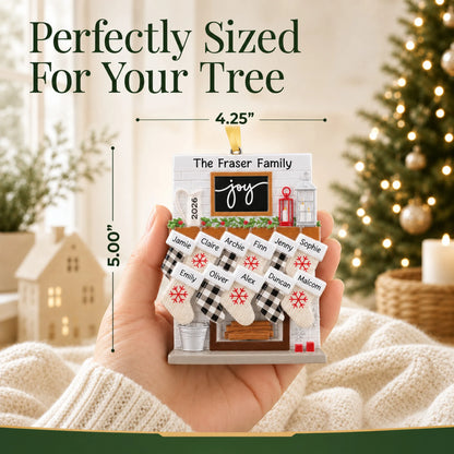 Size guide: the personalized fireplace stockings family of 11 christmas ornament shown in hand next to a Christmas tree