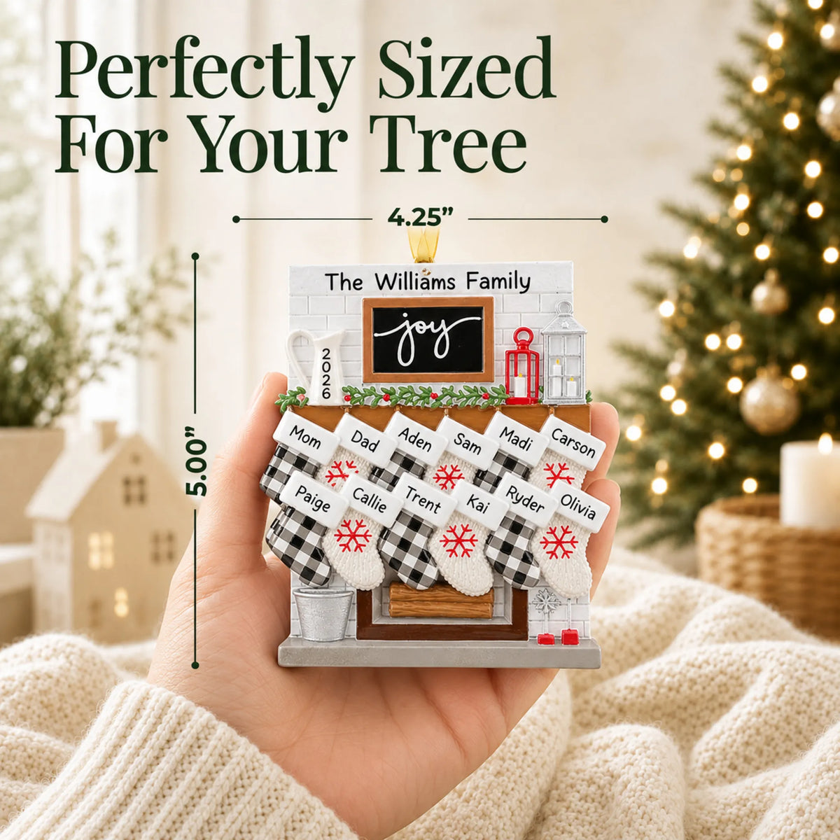 Size guide: the personalized fireplace stockings family of 12 christmas ornament shown in hand next to a Christmas tree