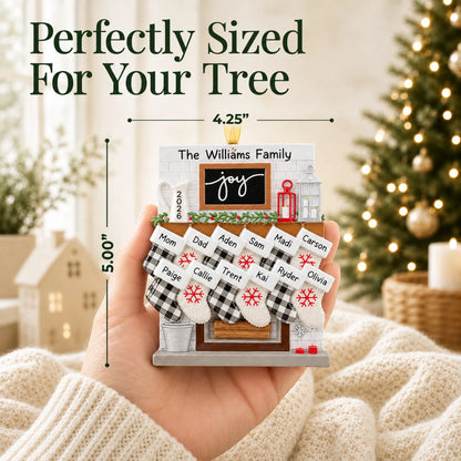 Size guide: the personalized fireplace stockings family of 12 christmas ornament shown in hand next to a Christmas tree