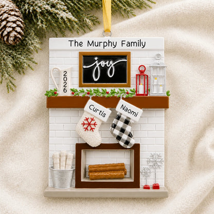 Personalized fireplace stockings family of 2 christmas ornament laid on a soft white knit blanket