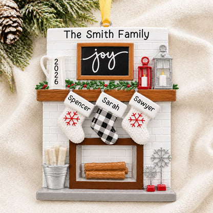 Personalized fireplace stockings family of 3 christmas ornament laid on a soft white knit blanket