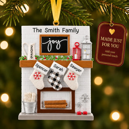 Fireplace stockings family of 3 christmas ornament hanging on a lit Christmas tree with a Made Just For You gift tag