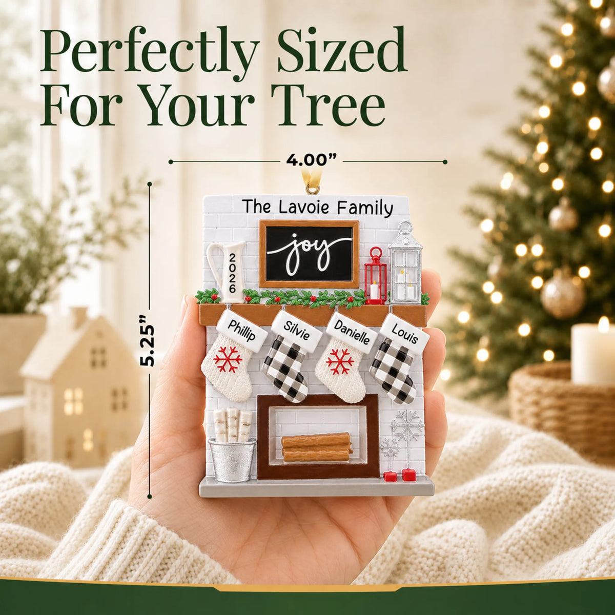 Size guide: the personalized fireplace stockings family of 4 christmas ornament shown in hand next to a Christmas tree