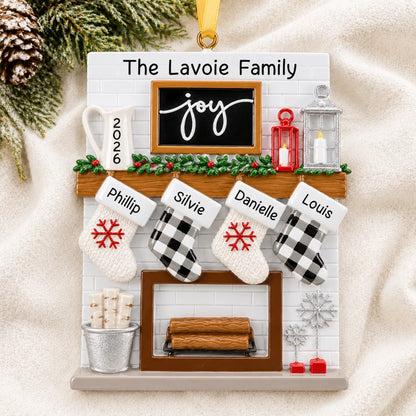 Personalized fireplace stockings family of 4 christmas ornament laid on a soft white knit blanket