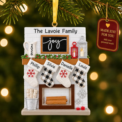 Fireplace stockings family of 4 christmas ornament hanging on a lit Christmas tree with a Made Just For You gift tag