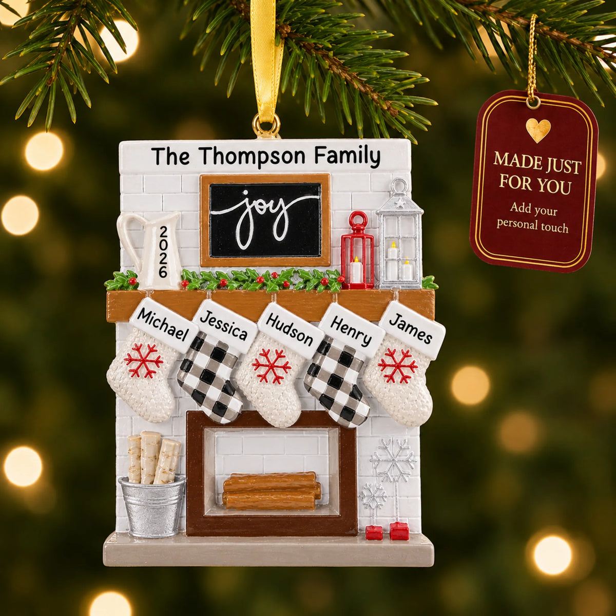 Fireplace stockings family of 5 christmas ornament hanging on a lit Christmas tree with a Made Just For You gift tag