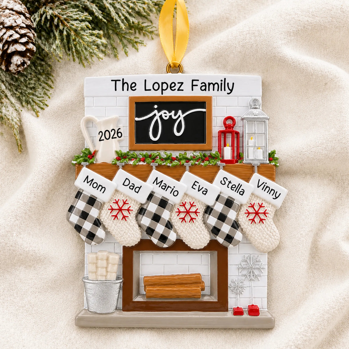 Personalized fireplace stockings family of 6 christmas ornament laid on a soft white knit blanket