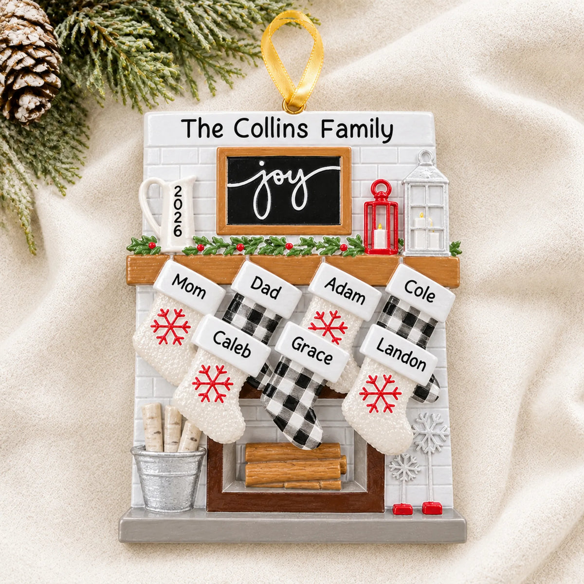 Personalized fireplace stockings family of 7 christmas ornament laid on a soft white knit blanket