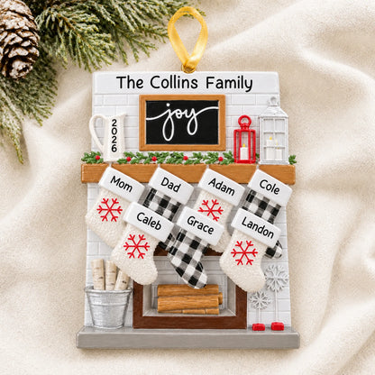 Personalized fireplace stockings family of 7 christmas ornament laid on a soft white knit blanket