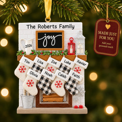 Fireplace stockings family of 9 christmas ornament hanging on a lit Christmas tree with a Made Just For You gift tag