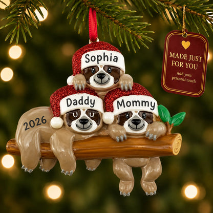 Sloth family of 3 christmas ornament hanging on a lit Christmas tree with a Made Just For You gift tag