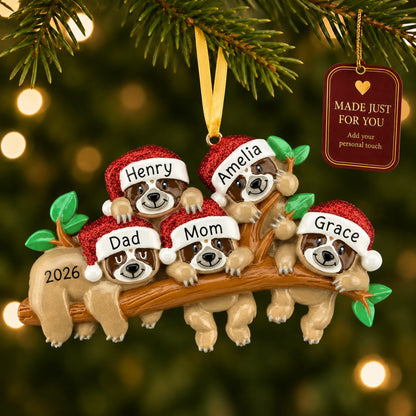 Sloth family of 5 christmas ornament hanging on a lit Christmas tree with a Made Just For You gift tag