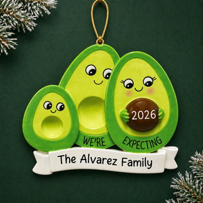 Personalized Avocado Expecting Family of 3 christmas ornament on a dark green pine background