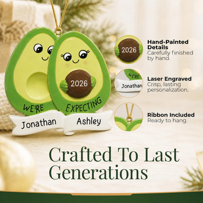 Hand-painted details and laser engraved personalization on the Avocado Expecting Couple christmas ornament, ribbon included