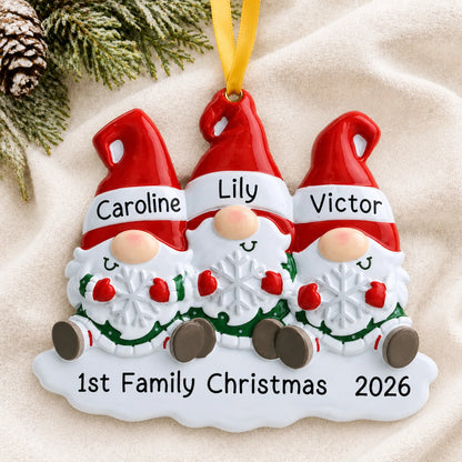 Personalized gnome family of 3 christmas ornament laid on a soft white knit blanket