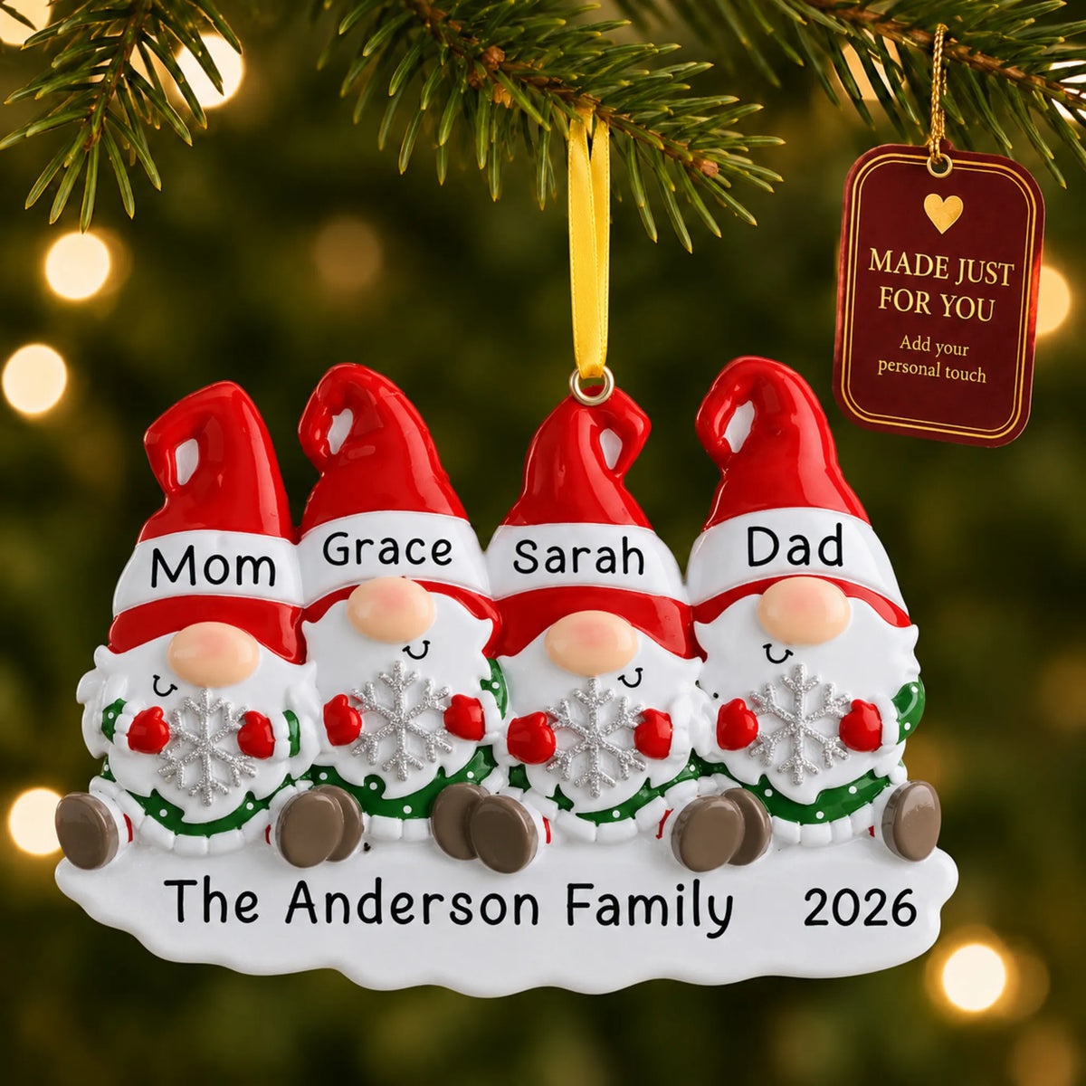 Gnome family of 4 christmas ornament hanging on a lit Christmas tree with a Made Just For You gift tag