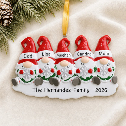 Personalized gnome family of 5 christmas ornament laid on a soft white knit blanket