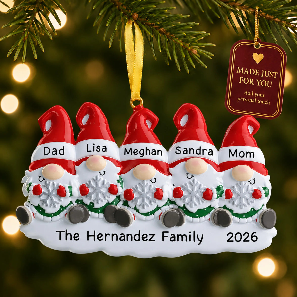 Gnome family of 5 christmas ornament hanging on a lit Christmas tree with a Made Just For You gift tag