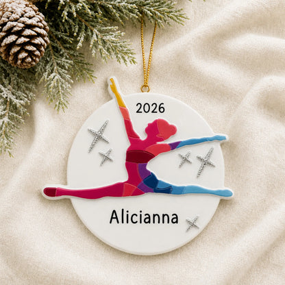 Personalized dance pose christmas ornament laid on a soft white knit blanket