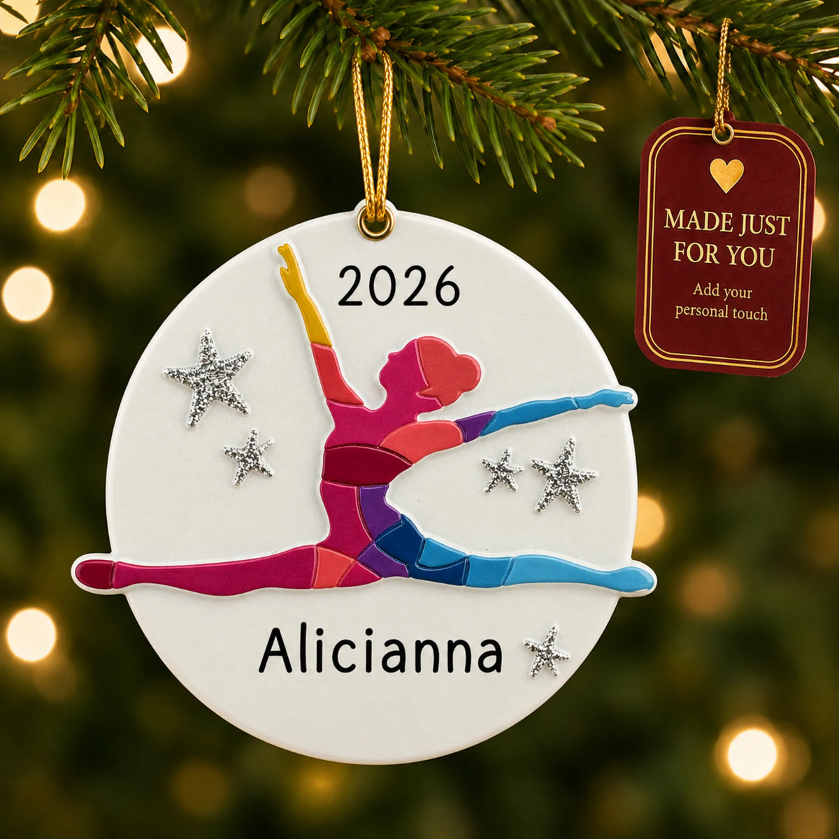Dance pose christmas ornament hanging on a lit Christmas tree with a Made Just For You gift tag
