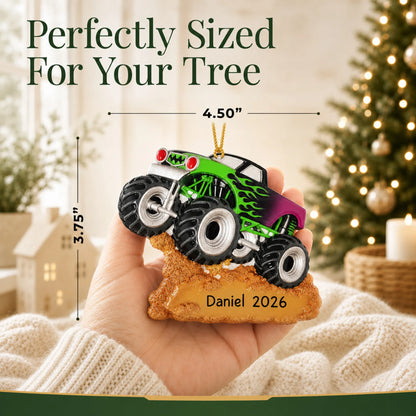 Size guide: the personalized monster truck christmas ornament is 4.50 in wide by 3.75 in tall, shown in hand