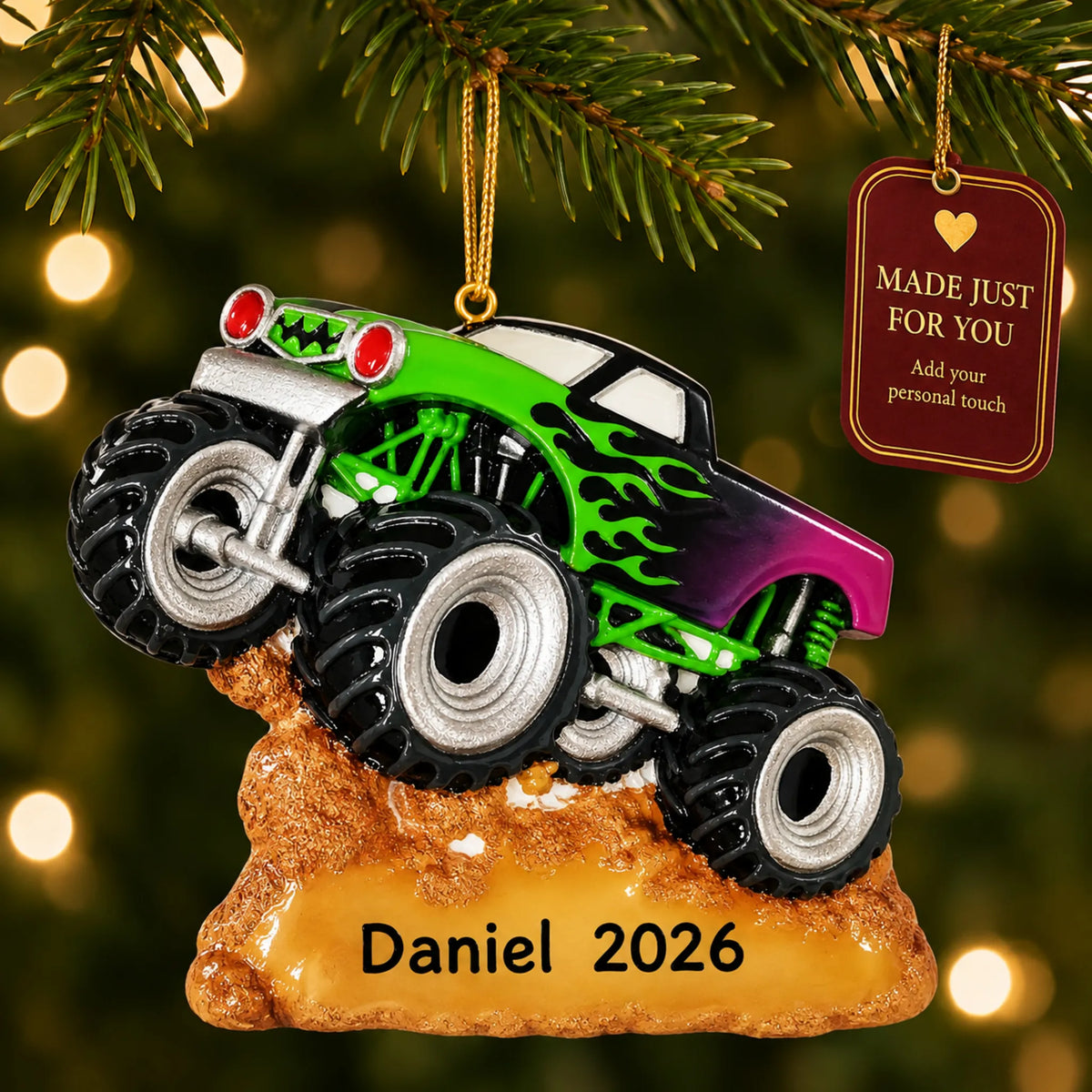 Monster truck christmas ornament hanging on a lit Christmas tree with a Made Just For You gift tag
