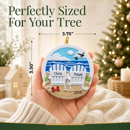 Size guide: the personalized beach adirondack chair couple christmas ornament shown in hand next to a Christmas tree