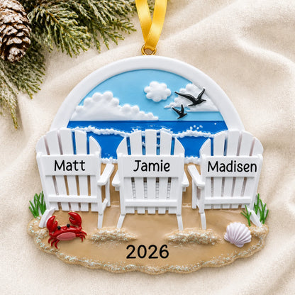 Personalized beach chair family of 3 christmas ornament laid on a soft white knit blanket