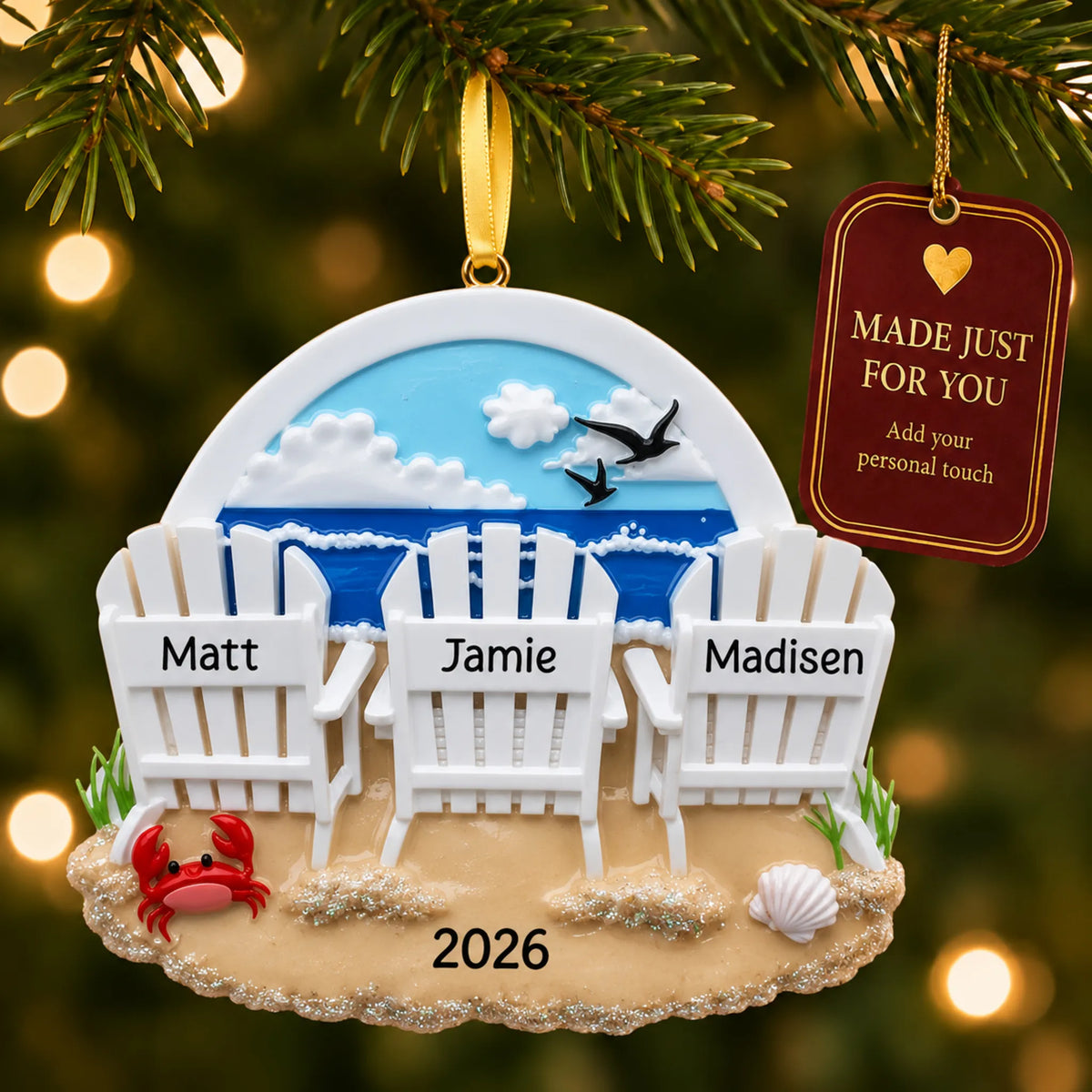 Beach chair family of 3 christmas ornament hanging on a lit Christmas tree with a Made Just For You gift tag