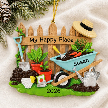 Personalized gardener christmas ornament laid on a soft white knit blanket