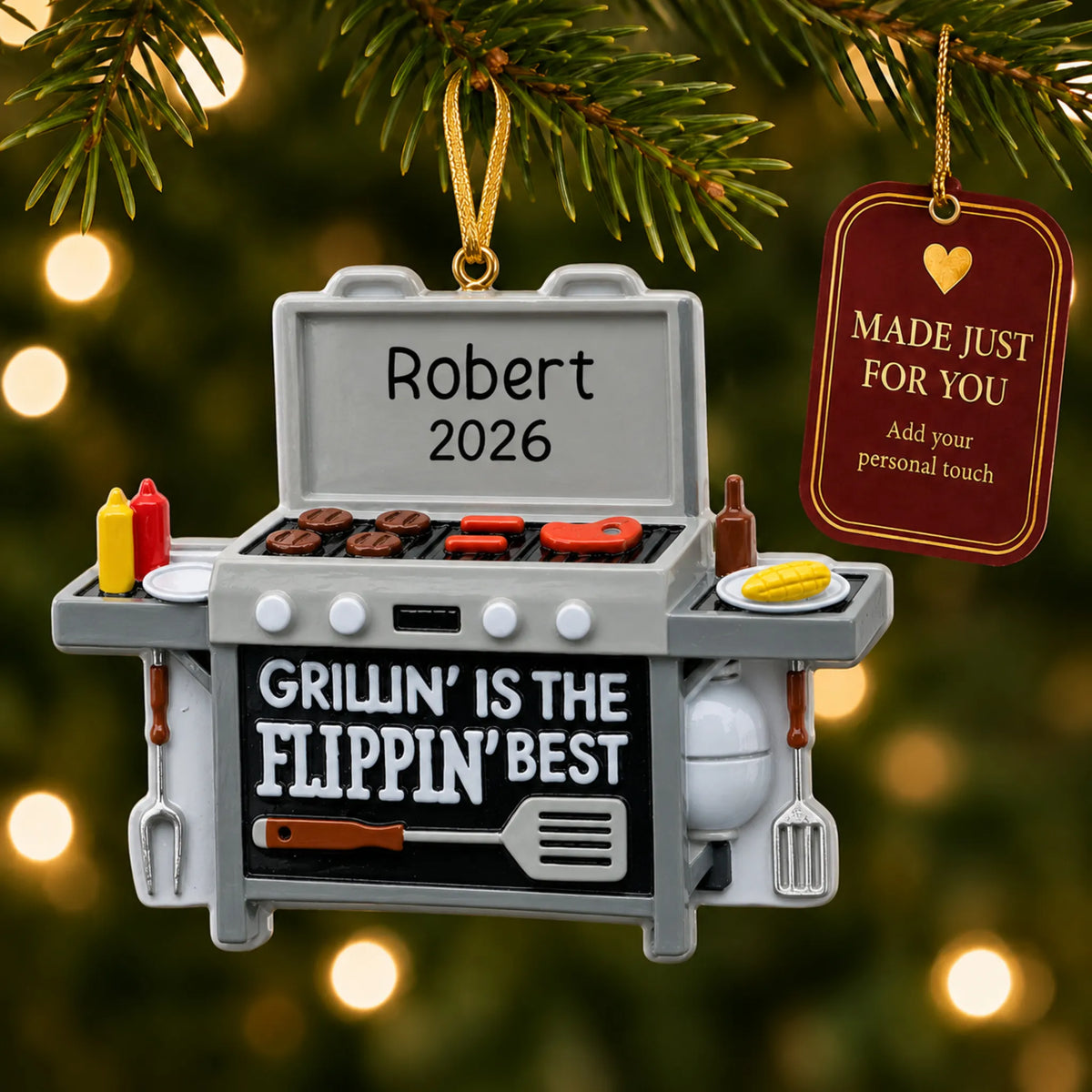 BBQ Grilling christmas ornament hanging on a lit Christmas tree with a Made Just For You gift tag