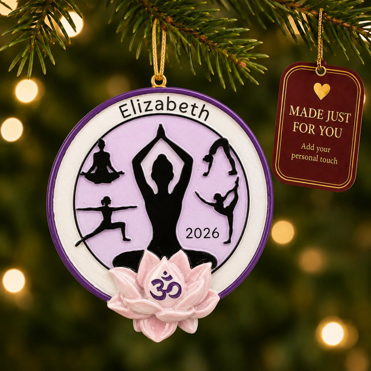 Yoga pose christmas ornament hanging on a lit Christmas tree with a Made Just For You gift tag
